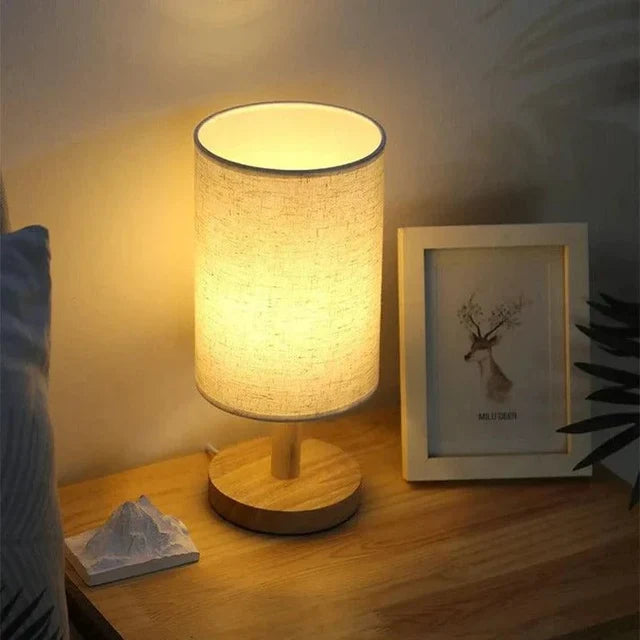 Solid wood table lamp with a cylindrical linen shade